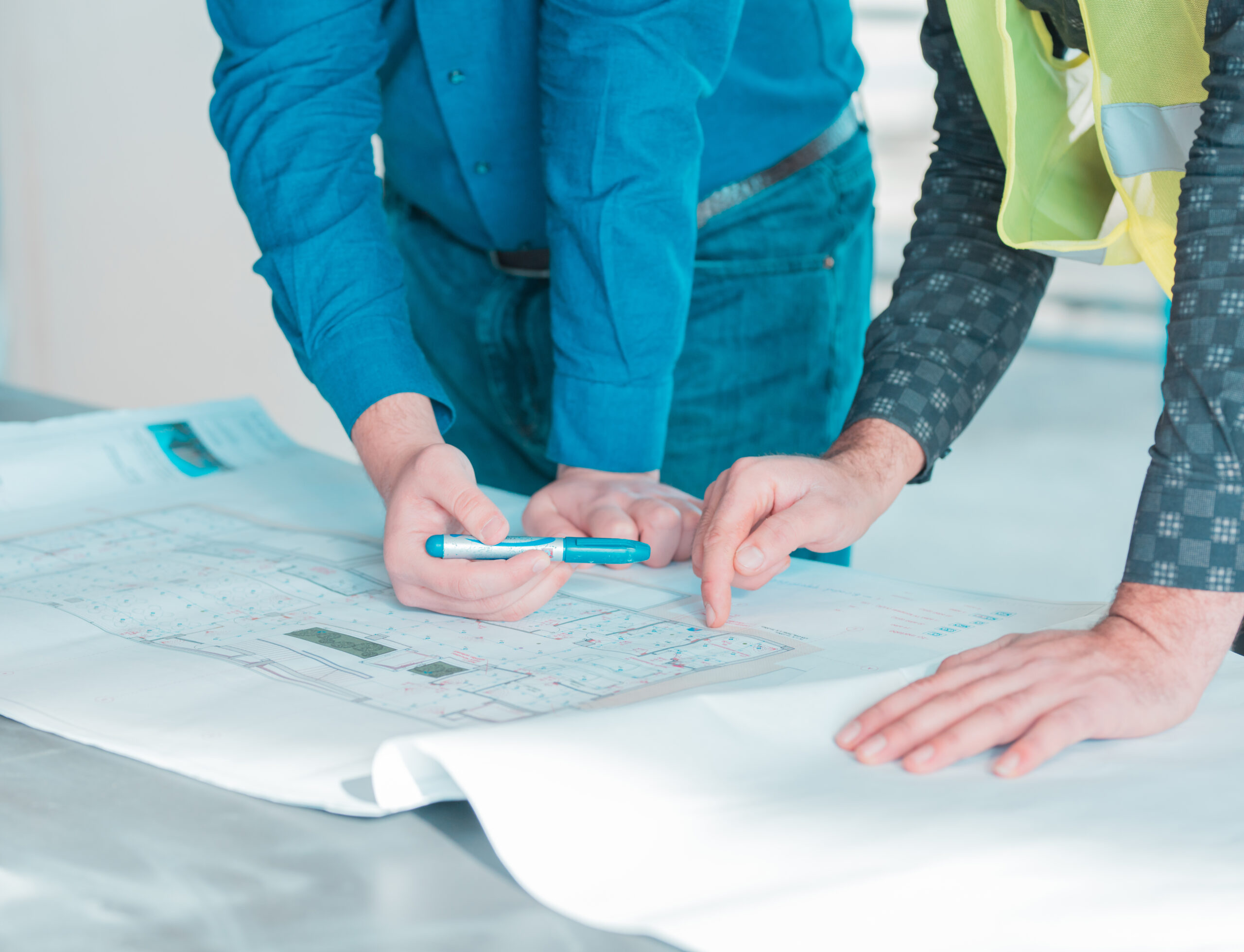 one-worker-showing-important-details-architectural-plan-project-another